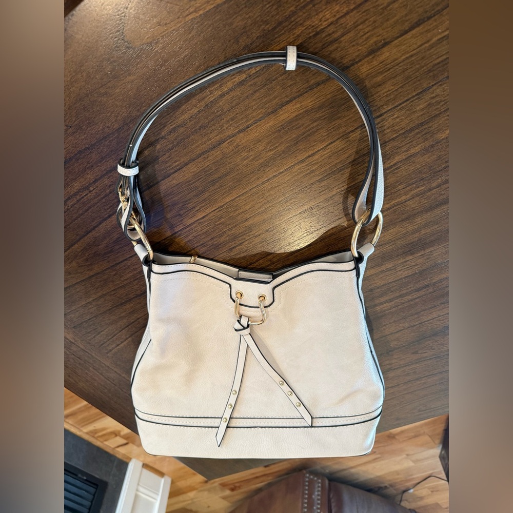 I Light colored faux leather hobo bag with gold-tone hardware like new condition